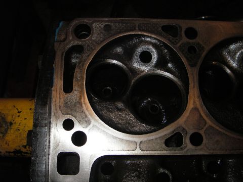 1972 Ford Ranchero - This is a close-up view of an engine's cylinder head, showing the combustion chambers and valve ports.