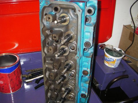 1972 Ford Ranchero - Close-up of a disassembled engine cylinder head, showing internal components and a blue painted exterior.