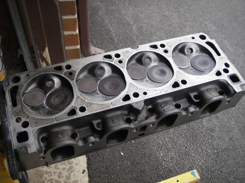 1972 Ford Ranchero - Close-up of an engine cylinder head, valves with the Ford logo visible.