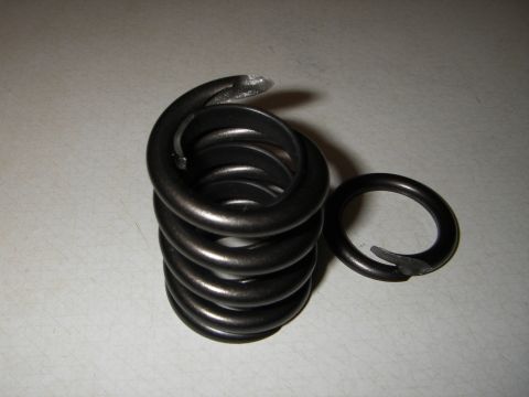 1972 Ford Ranchero - A damaged valve spring and retainer clip are shown, indicating a mechanical part failure.