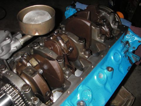 1972 Ford Ranchero - Close-up view of an engine block's internal components, including the crankshaft and connecting rods, with an oil pickup screen visible.