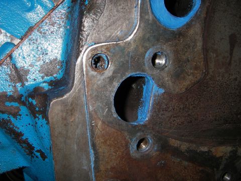 1972 Ford Ranchero - Engine block part with blue sealant applied around bolt holes.