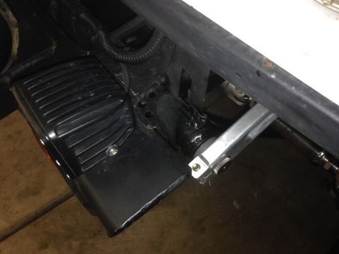 1987 Suzuki Samurai - Close-up of an aftermarket LED light and a suspension part, likely from a vehicle's undercarriage.
