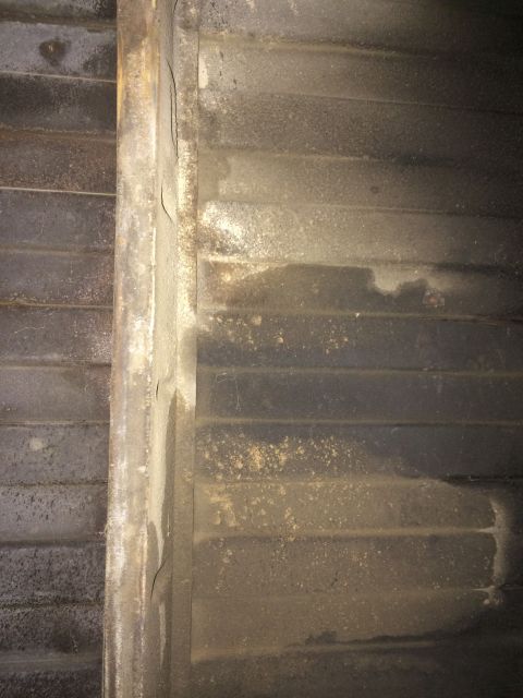 1964 Ford Ranchero - Corroded metal panel with horizontal ridges, possibly from a vehicle's undercarriage.