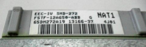 1990 Ford Bronco - Close-up of an electronic control unit showing part numbers and a barcode.