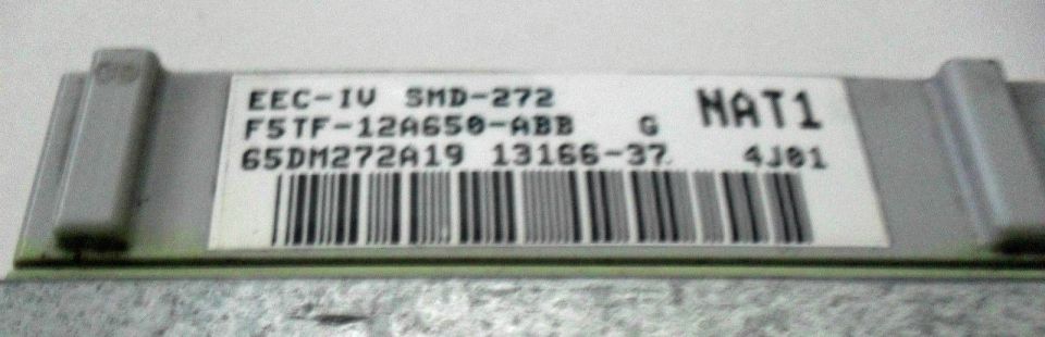 Electronic control unit with label EEC-IV SMD-272 F5TF-12A650-ABB 65DM272A19 13166-37 G NAT1 4J81