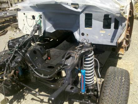 1982 Ford Bronco - Front chassis and firewall of a 1982 Ford Bronco undergoing restoration or repair.