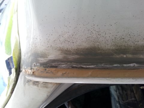 1992 Ford Bronco - seam sealer in the drivers side rain gutter.