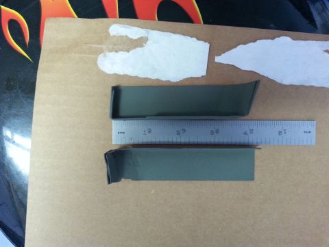 1992 Ford Bronco - Two automotive trim pieces are shown with a ruler for scale, possibly for a repair or restoration project.