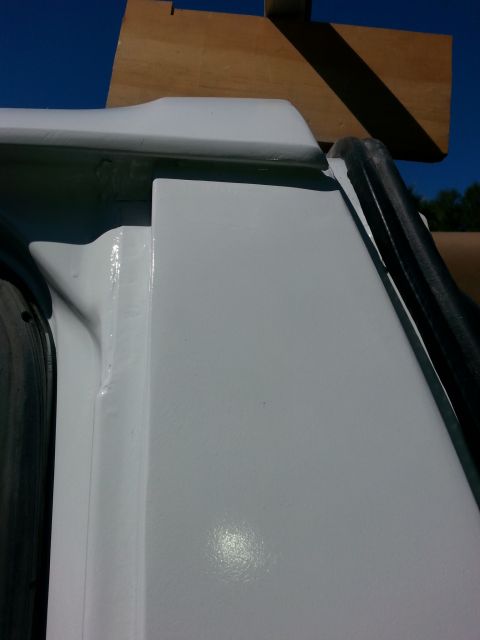 1992 Ford Bronco - Detail of a vehicle's door frame, showing the seal and surrounding bodywork.