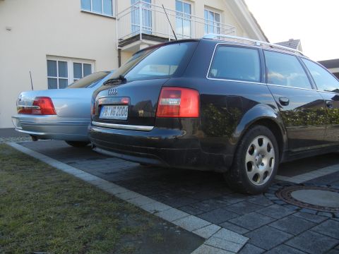 1999 Ford Fairlane - Rear view of a black Audi wagon parked next to a silver sedan. The license plate reads PB-WG 2006.