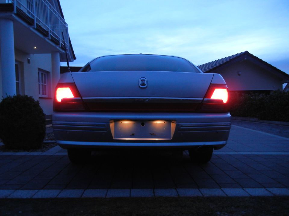 1999 Ford Fairlane rear view with brake lights on