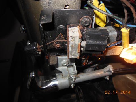 1979 Ford F-150 - Close-up of a vehicle's steering column ignition switch assembly and associated wiring.