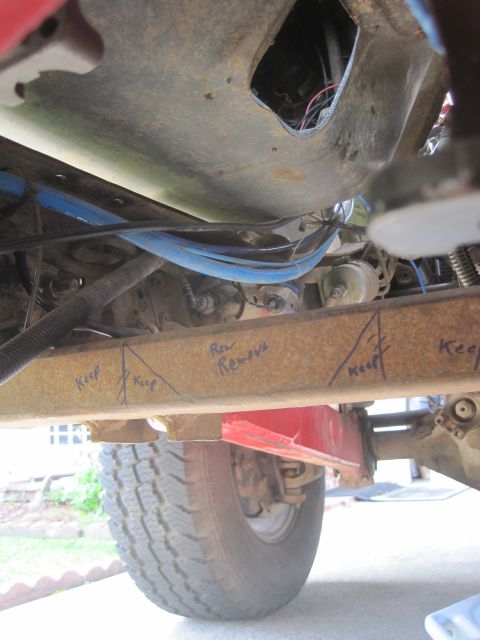 1989 Ford Bronco - Markings on the vehicle frame indicate areas to keep and areas to remove during modification.