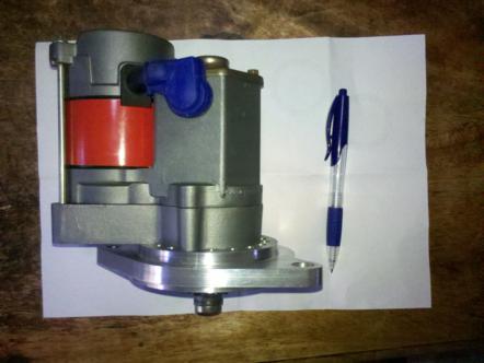 1982 Ford Bronco - An engine part, possibly a fuel pump or distributor, is shown next to a pen for scale. The registry claims it is from a 1982 Ford Bronco, b…