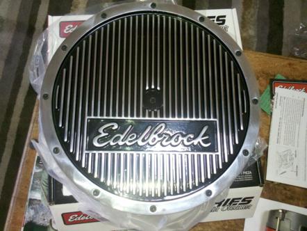 1982 Ford Bronco - Edelbrock oil pan with "Edelbrock" script logo. Box and instructions are visible.