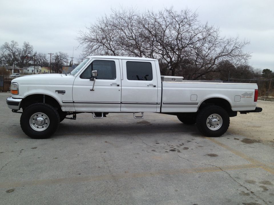 White 1997 Ford F-350 crew cab pickup truck, side view