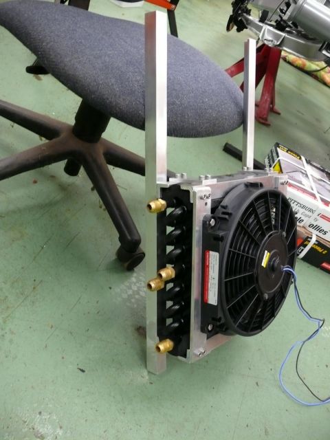 oil cooler and fan assembly mounted on aluminum brackets