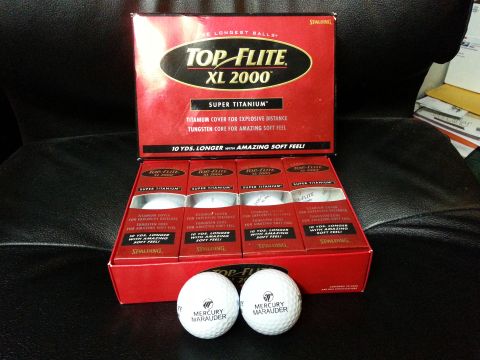 2003 Mercury Marauder - Promotional golf balls branded with Mercury Marauder logo are displayed with their packaging.