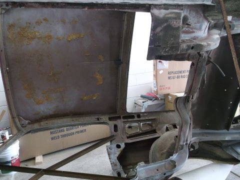 1967 Ford Mustang - This photo shows the interior of a car body undergoing restoration, with replacement parts visible.