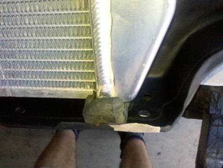 1982 Ford Bronco - Close-up view of a vehicle's radiator and its mounting bracket, with a Supermotors.net watermark visible.
