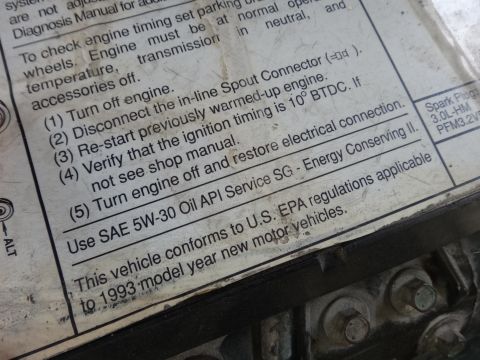 1993 Ford Taurus - Sticker in the engine bay indicates the vehicle is a 1993 model year.
