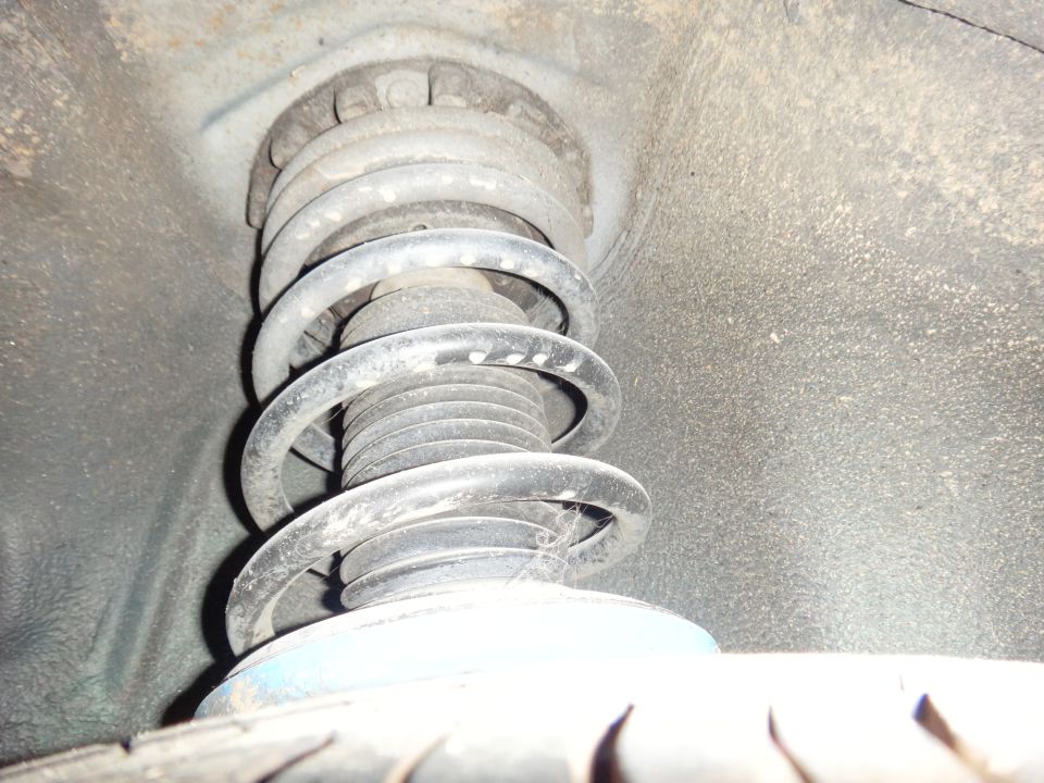 Front suspension strut and coil spring, close-up view