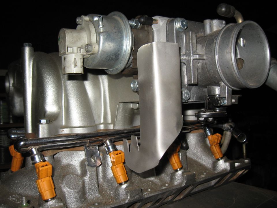 Close-up of Ford fuel injectors and throttle body assembly