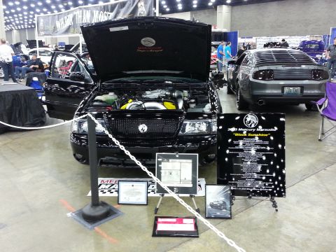 2003 Mercury Marauder - A black 2003 Mercury Marauder is displayed with its hood open at a car show.