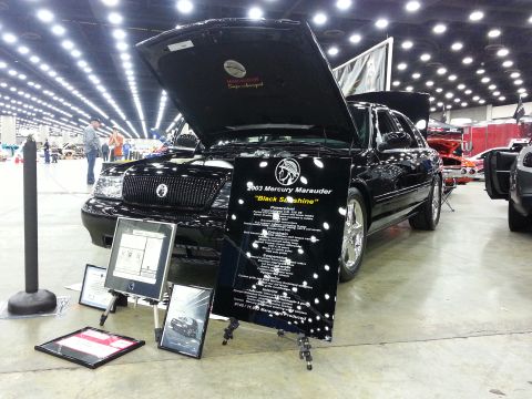 2003 Mercury Marauder - A black 2003 Mercury Marauder is displayed with its hood and trunk open at an indoor event.