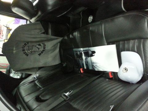 2003 Mercury Marauder - Interior view of a car, a Mercury Marauder branded cover and a brochure.