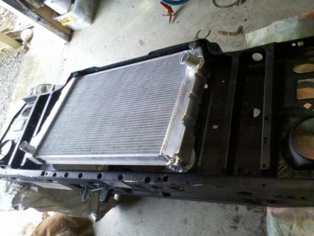 1982 Ford Bronco - The front frame assembly holds a new aluminum radiator, ready for installation.
