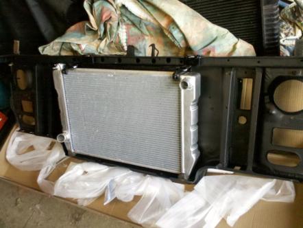 1982 Ford Bronco - Radiator and mounting bracket assembly, likely for a vehicle. Supermotors.net logo visible.