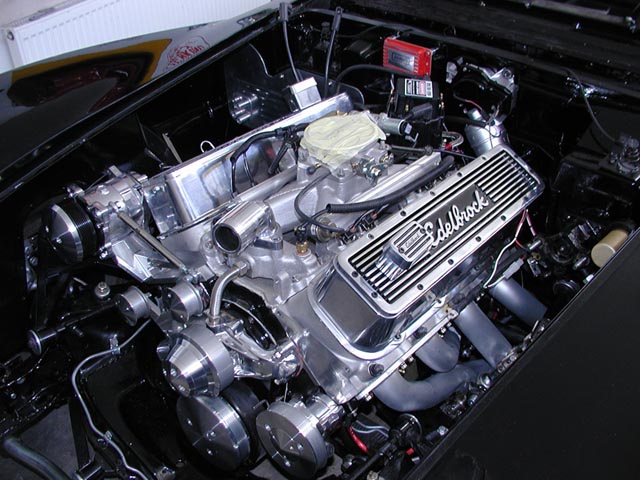 Engine bay with chrome Edelbrock valve covers and dual carburetors