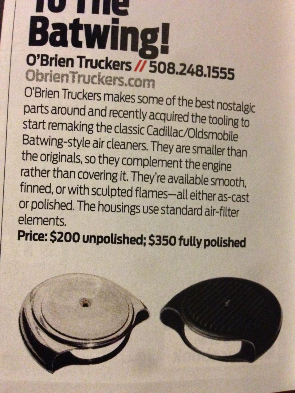 Two air cleaner housings, one polished metal and one black, for Cadillac/Oldsmobile Batwing style