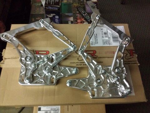 1964 Ford Fairlane - Pair of custom polished aluminum hood hinges are shown resting on cardboard packaging.