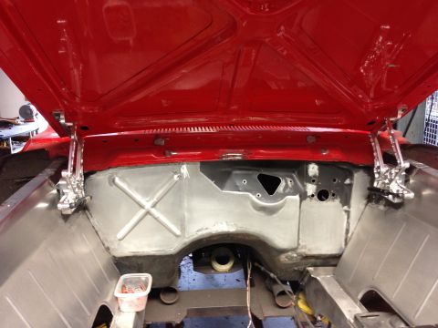 1964 Ford Fairlane - Firewall and inner fenders of a 1964 Ford Fairlane undergoing restoration, hood is open.