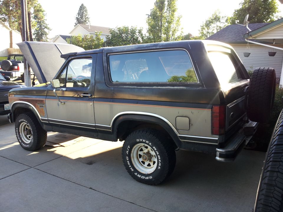 1986 Ford Bronco, two-tone brown/silver, hood open, spare tire on rear