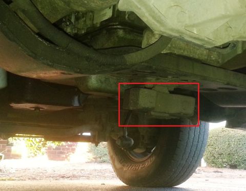 2001 Ford Excursion - A close-up view of a vehicle's undercarriage, with a specific component outlined in red.