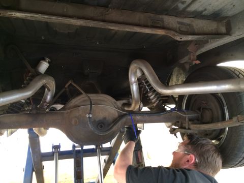 1964 Ford Ranchero - Custom exhaust system installation on a 1964 Ford Ranchero's rear axle.