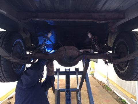 1964 Ford Ranchero - Welding work being done on the rear suspension and axle of a vehicle.