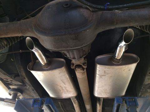 1964 Ford Ranchero - Underside view of a 1964 Ford Ranchero's dual exhaust system and rear axle assembly.