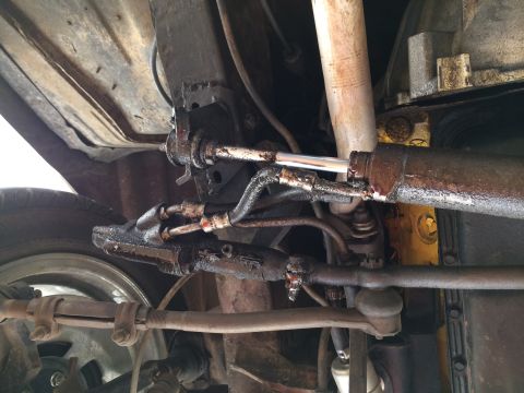 1964 Ford Ranchero - Underside view of the power steering system, showing the cylinder and linkage components.