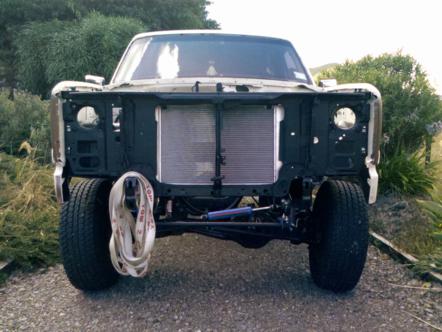1982 Ford Bronco - This truck is missing its front body panels, revealing the engine bay components and suspension.