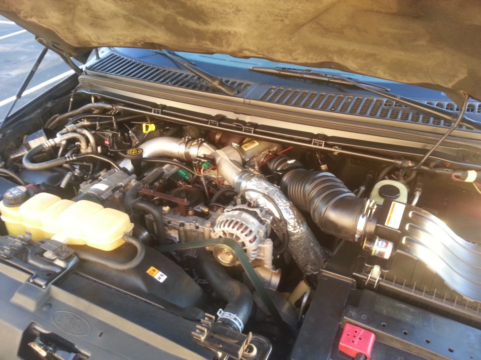 Engine bay of a 2001 Ford Excursion with hood open