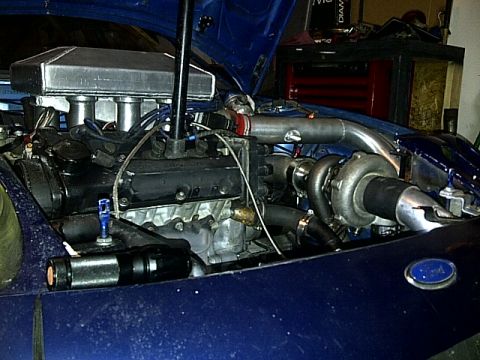 1995 Ford Probe - Customized engine bay a turbocharger and aftermarket intake system.