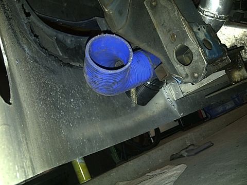 1995 Ford Probe - Close-up view of engine components including a blue silicone hose.