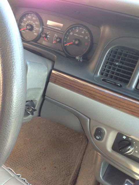 2007 Ford Crown Victoria - Interior view of a 2007 Ford Crown Victoria dashboard, showing gauges and air vents.