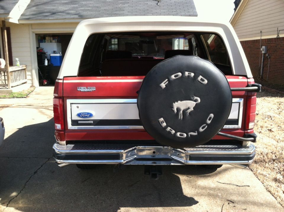 1986 Ford Bronco rear view, showing spare tire cover with Bronco emblem and Ford logo on tailgate
