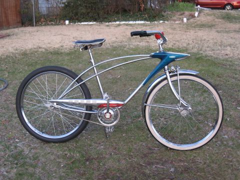 1994 Ford Bronco - A vintage-style bicycle with chrome frame and blue accents sits on grass.